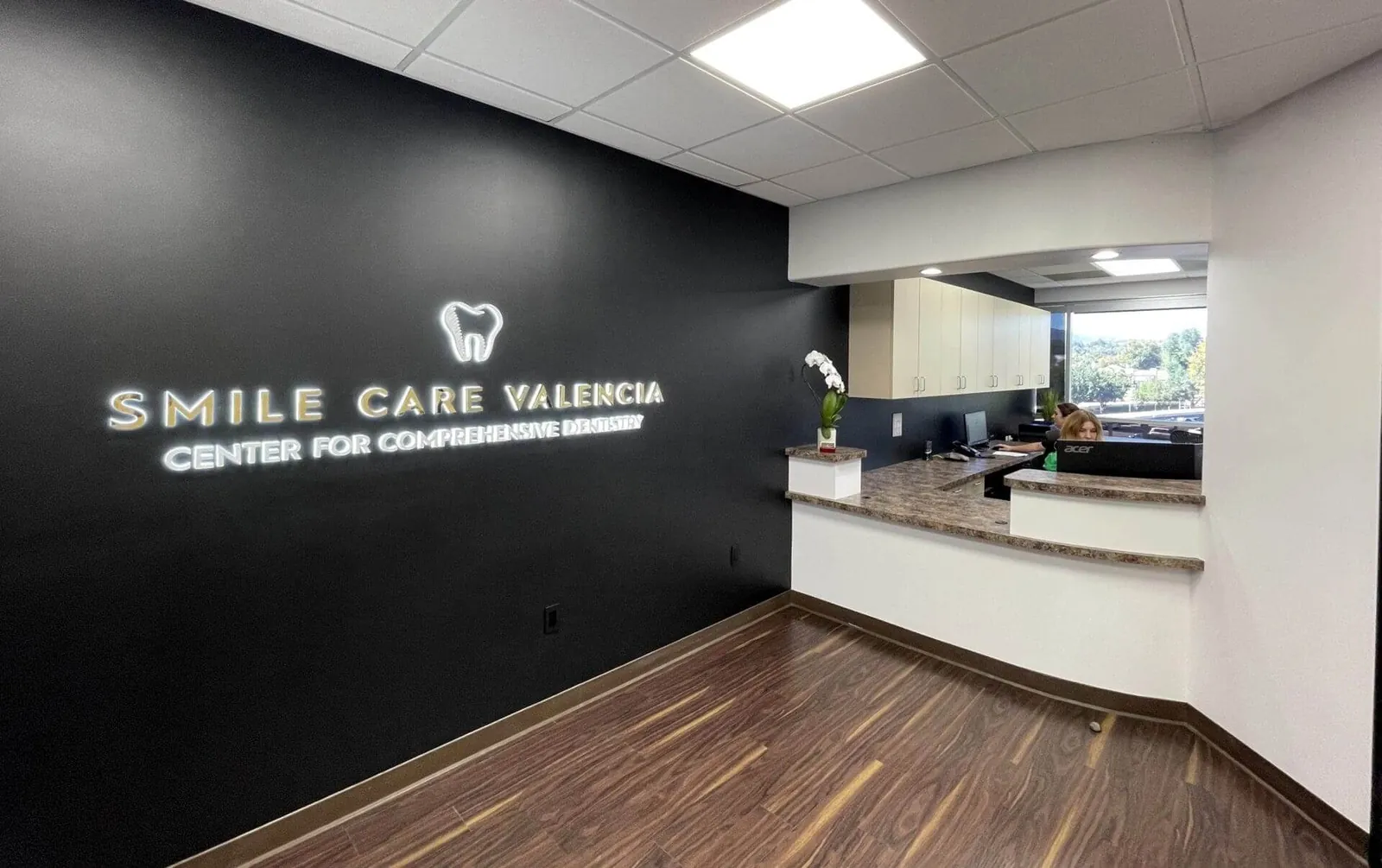 Smile Care Valencia dental office reception.